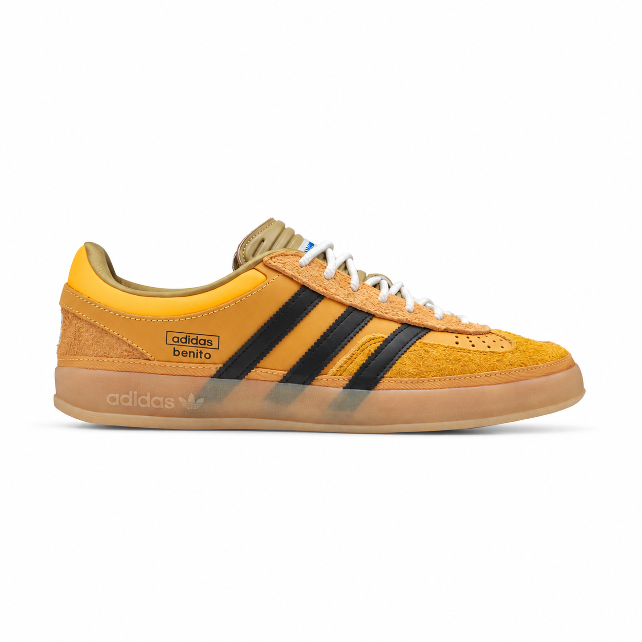 Side view of adidas x Bad Bunny Gazelle Indoor Solar Gold sneaker with black stripes and gum sole on white